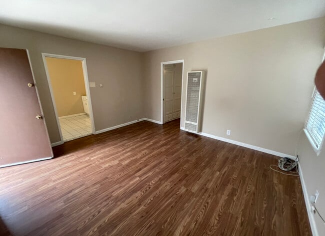 Enter the livingroom looking into kitchen - 2540 W Ramona Rd Apartments