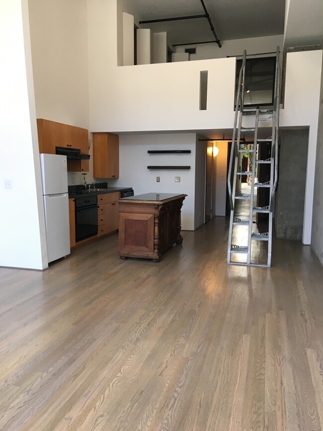 Kitchen view and warehouse steps to sleeping loft - 461 2nd St