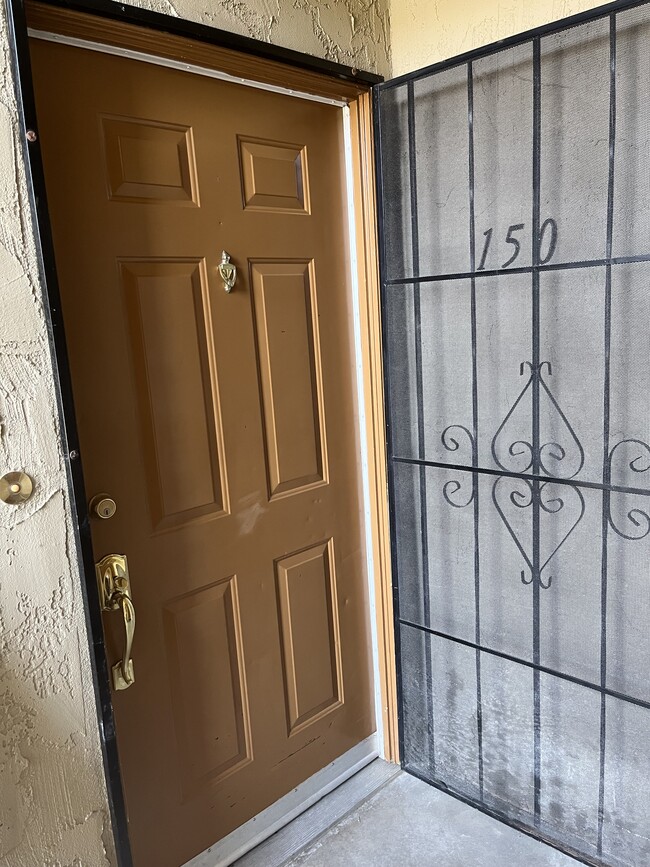 front door to uni, with security screen doort - 589 N Johnson Ave