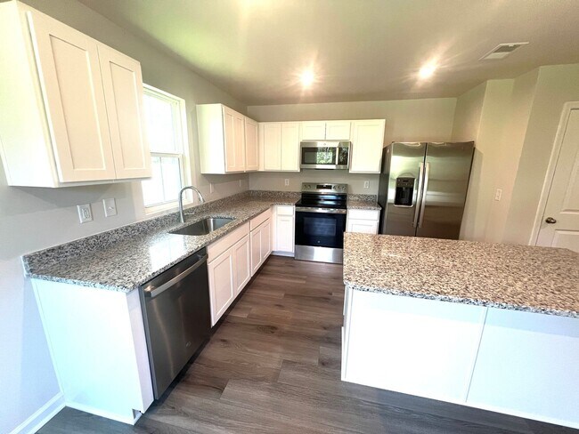 Building Photo - New Three-Bedroom, Two and one-half Bath T...