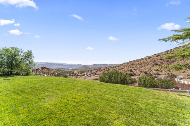 Building Photo - "Spacious Ranch Style 4-Bedroom Oasis with...
