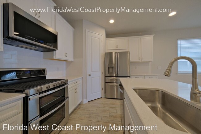 Building Photo - 4 br, 3 bath House - 5854 Long Shore Loop