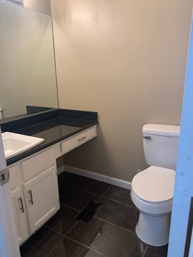 Main level half bath - 7446 S Winston Ave
