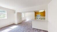 Located at 500 Robins Way in Westminster, MD, this single-floor unit offers a practical and well-organized layout designed for comfortable everyday living. The open-concept main living area is generously proportioned, featuring neutral-toned carpeting that extends throughout and crisp white walls that enhance the sense of brightness. Multiple windows allow natural light to filter in, creating an airy atmosphere across the living space.

The kitchen is positioned adjacent to the living area, separated by a peninsula-style counter that provides both workspace and a natural visual boundary. Warm honey-toned wood cabinetry lines the kitchen walls, offering ample storage, while white appliances—including a range, refrigerator, and dishwasher—provide full functionality. A stainless steel sink and light-toned countertops complete the kitchen's clean, efficient design.

The bedrooms are carpeted and filled with natural light from outward-facing windows framing views of surrounding greenery. Each bedroom includes dedicated closet space, with at least one featuring a walk-in closet with built-in shelving and rod storage. Wood-style flooring transitions into the closet and entryway areas.

The bathroom is finished with white tile surrounding the tub and shower, complemented by a wood-toned vanity, light countertop, and a window that introduces additional natural light. The overall design is clean, neutral, and functional throughout.