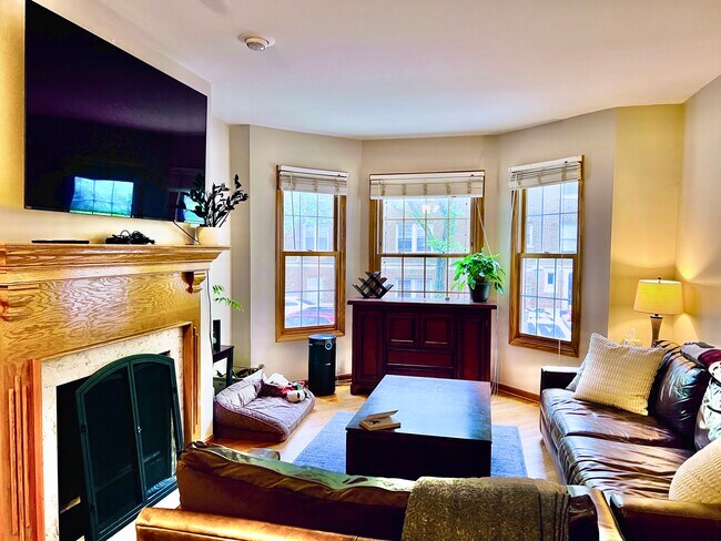 Spacious Open Living Room layout with Bay Windows & Fireplace - 1059 W Cornelia Ave