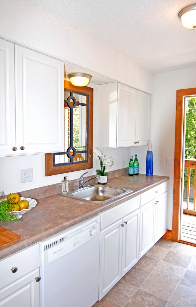 Kitchen with door to back balcony - 254 S Durkin Dr