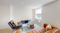Located at 2024 Jane St in Pittsburgh's South Side neighborhood, this one-bedroom, one-bathroom unit offers a thoughtfully designed, modern living space across a single floor. Light wood flooring runs throughout, lending warmth and continuity to the open layout.

The living room is bright and airy, featuring a large window with city views, recessed lighting, and clean white walls that create a welcoming, minimalist atmosphere. The kitchen is well-appointed with light wood cabinetry, stainless steel appliances including a range, microwave, and dishwasher, and a functional galley-style layout. A dining area adjacent to the kitchen benefits from natural light through a side window.

The bedroom is a calm, comfortable retreat with two windows that allow ample natural light and offer exterior views. A double-door closet provides generous storage, and the light flooring continues seamlessly from the rest of the unit.

The bathroom is finished in a contemporary style, featuring a wood-toned vanity with an illuminated mirror, light wood-look flooring, and a walk-in shower enclosed by sleek black-framed glass doors. The overall design of the unit is clean, modern, and cohesive, making efficient use of its compact footprint while maintaining a comfortable and stylish living environment.