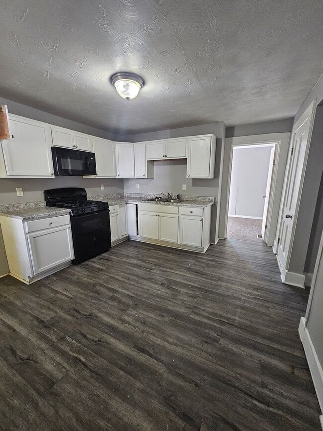 Building Photo - There is a $25 fee per application and everyone over 18 needs to fill out their own application.