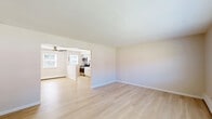 Located at 498 Plaza Blvd in Morrisville, PA, this well-appointed 2-bedroom, 1-bathroom residence offers a thoughtfully designed single-floor layout. Light hardwood flooring flows throughout the main living areas, creating a bright and cohesive feel. The updated kitchen is a standout feature, showcasing white shaker cabinetry, a classic subway tile backsplash, stainless steel appliances including a gas range, microwave, dishwasher, and refrigerator, complemented by a peninsula that adds additional counter space and a natural division between the kitchen and living area. The spacious living room is bathed in natural light from a large window and includes a convenient entry door. Both bedrooms are carpeted for comfort and feature neutral tones; the generously sized primary bedroom offers two windows that bring in ample natural light, while the second bedroom includes a closet with double doors. An in-unit washer is also present, adding everyday convenience. The full bathroom features clean white subway tile surrounding the tub and shower. Clean lines, neutral finishes, and practical design elements make this a move-in-ready residence in a well-established Morrisville community.