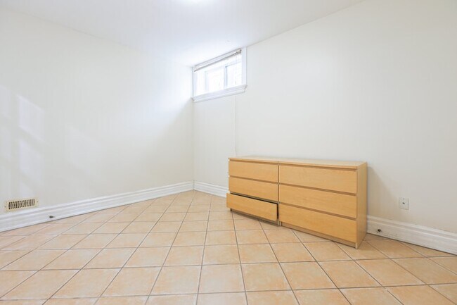 Building Photo - Bright, Beatutiful & Look Out Basement Apt.