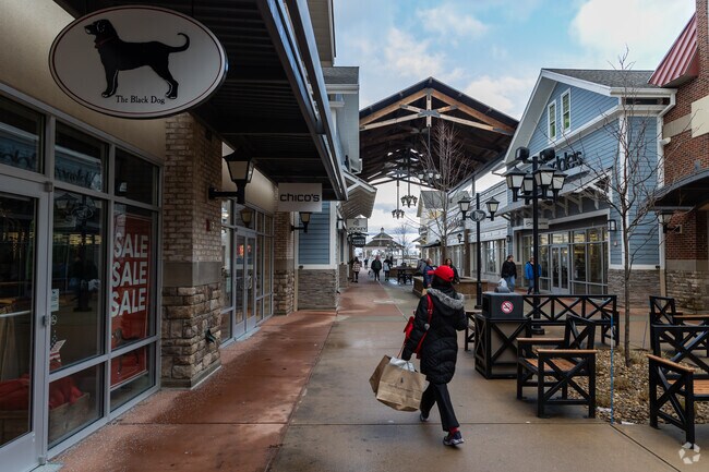 A shopper at Merrimack Premium Outlets in Merrimack, NH.