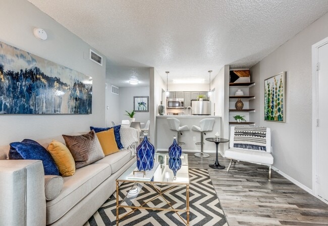 Dallas Apartments – Modern Living Room with Wood-Style Floors - Fountains of Jupiter Apartments