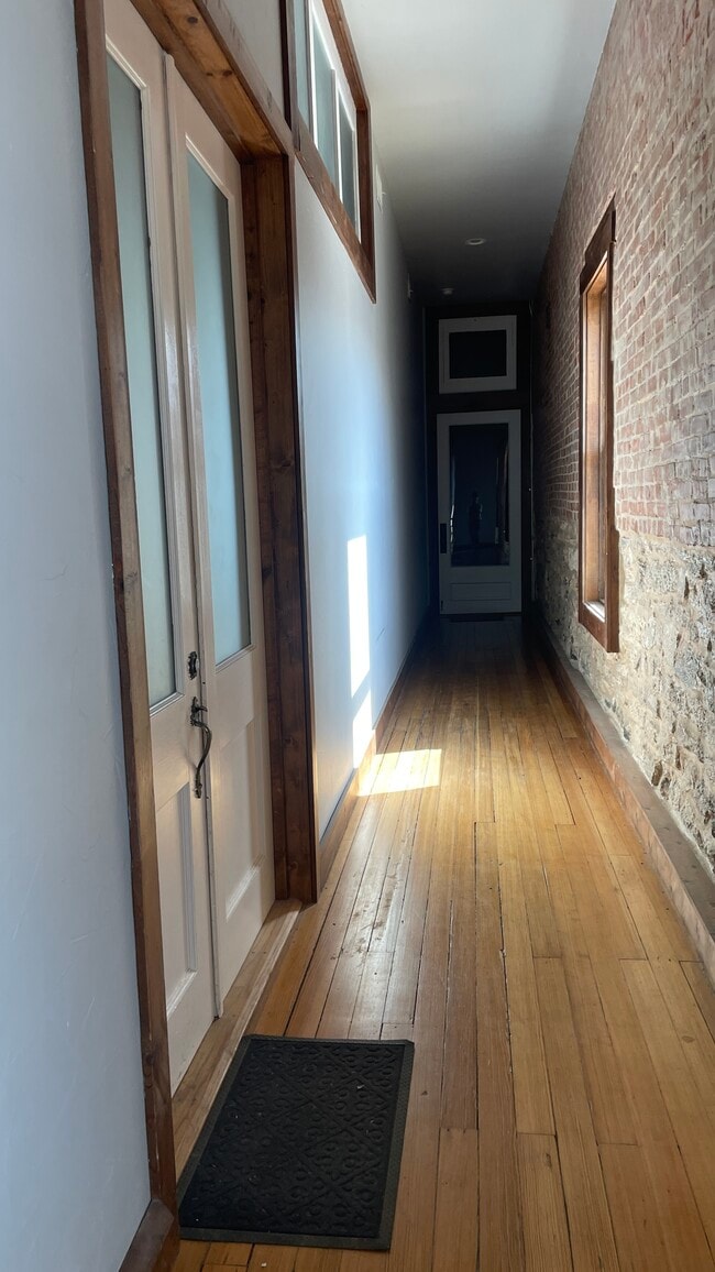 The stairs/hallway is shared with the unit that faces main street. - 121 Clifton Art Aly