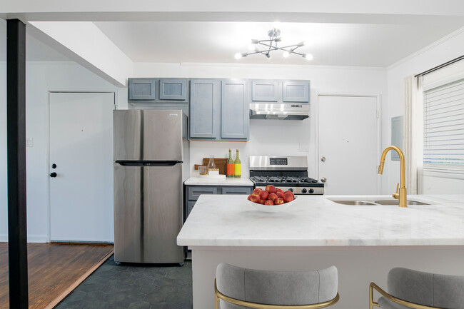 Kitchen with Stainless Steel Appliance and Large Kitchen Island - Ann Street Lofts