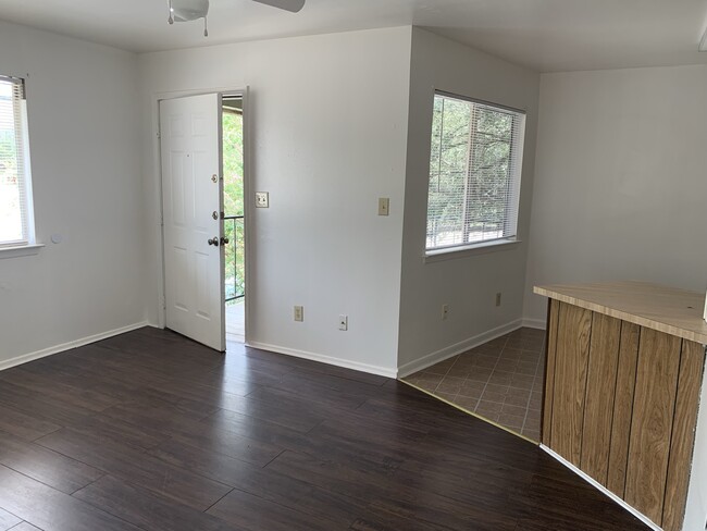 Standing in living room looking to front door and kitchen - 1646 Post Rd