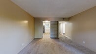 Located at 3347 Cottage Way in Arden-Arcade, California, this single-floor, one-bedroom, one-bathroom unit offers a well-organized and comfortable layout. The entry hallway, finished with wood-look flooring, connects the main living spaces and sets a clean, neutral tone throughout.

The living room is generously sized with plush carpeting, warm beige walls, and a textured ceiling. Natural light filters in through windows, creating a bright and welcoming atmosphere. Built-in shelving adds a functional and practical touch to the space.

The kitchen features wood-look flooring, white cabinetry, light countertops, and black appliances including a refrigerator, gas range, and dishwasher. A window above the sink allows for natural light, and a pantry provides additional storage.

The bedroom is a comfortable size with soft carpeting, a ceiling fan with light fixture, and a window overlooking greenery outdoors. Multiple closets offer ample storage throughout the unit.

The bathroom includes a combination tub and shower with a tiled surround, wood-look flooring, and clean white fixtures. Additional spaces include a utility room, hallways, and a private patio, rounding out a practical and well-appointed unit.