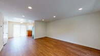 Located on Grove Way in Castro Valley, California, this two-floor residence offers a practical and comfortable layout with consistent finishes throughout. The main living area features warm wood-look flooring and recessed lighting, creating a bright, open atmosphere. Natural light flows in through vertical-blind-covered windows, enhancing the clean, neutral-toned walls.

The kitchen is well-appointed with honey-toned wood cabinetry offering generous storage, granite-style countertops, stainless steel appliances including a range, microwave, dishwasher, and refrigerator, and a undermount sink positioned near a sliding glass door for added natural light.

The bedrooms are carpeted for comfort and each includes windows that bring in outdoor views and natural light, maintaining a quiet, understated atmosphere. The bathrooms are finished with tile flooring and feature granite countertops. One bathroom includes a dual-sink vanity and a separate shower area, providing added functionality.

Throughout the space, the design emphasizes clean lines, neutral palettes, and practical finishes, creating a cohesive and livable environment across both floors.