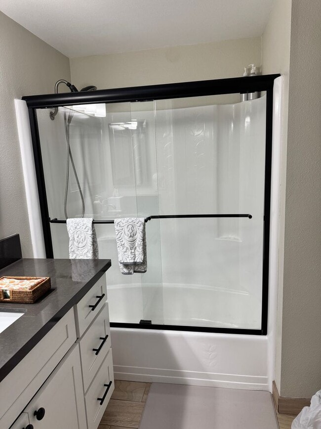 Photo - Charming 2-Bedroom, 1.5-Bath Apartment with Private Yard and 1 Car Garage