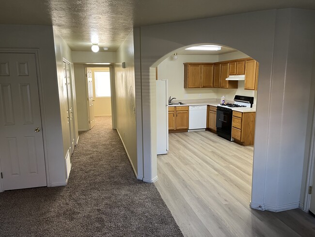 Kitchen and hallway with new flooring - 629 W Evans Ridge Cir