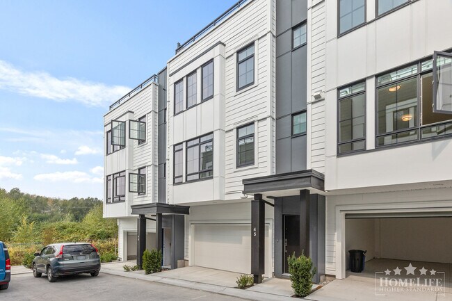 Photo du bâtiment - Modern 2-Bed + Den Townhome with Rooftop P...