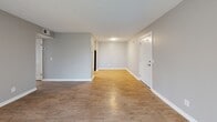 This Nashville residence offers a well-designed living space of 840 square feet, featuring 2 bedrooms and 3 bathrooms. The home boasts a modern aesthetic with neutral gray walls and warm wood-look flooring throughout. The open-concept living area creates a seamless flow between spaces, ideal for entertaining or everyday living. The updated kitchen showcases white cabinetry, stainless steel appliances, and ample counter space. Both bedrooms are generously sized, with the primary bedroom measuring 140 square feet. The bathrooms feature contemporary fixtures and finishes. Large windows in the living areas and bedrooms allow for plenty of natural light, enhancing the bright and airy atmosphere. A walk-in closet provides excellent storage options. The property's layout is efficiently designed, maximizing the use of space in each room. Located at 345 Burning Tree Dr, this single-story home offers a comfortable and stylish living environment in a desirable Nashville neighborhood.