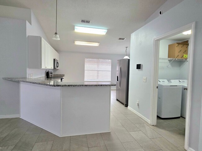 Building Photo - Charming 4BR/2BA Brick Home with Solar Panels