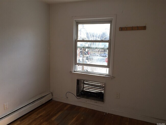 Building Photo - 43-18 Dahlia Ave
