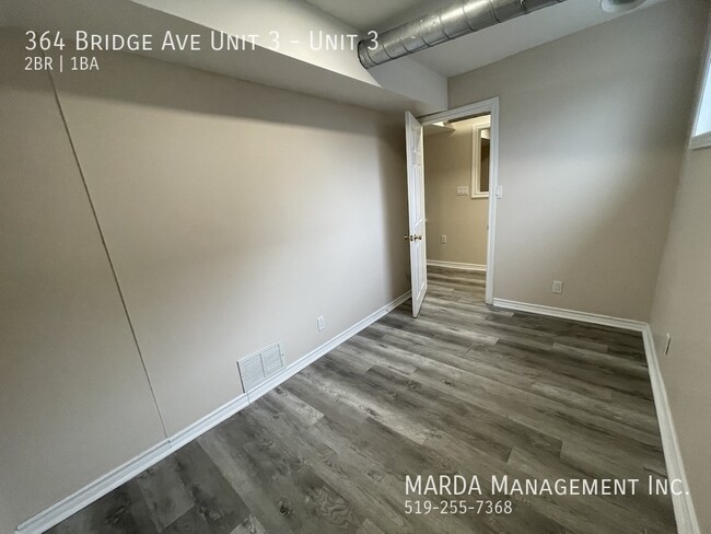 Building Photo - UPDATED 2-BEDROOM/1-BATH MAIN FLOOR UNIT-I...