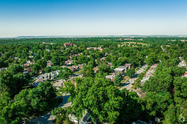 Aerial shoot looking from neighborhood with St Agnes school and church in bg.