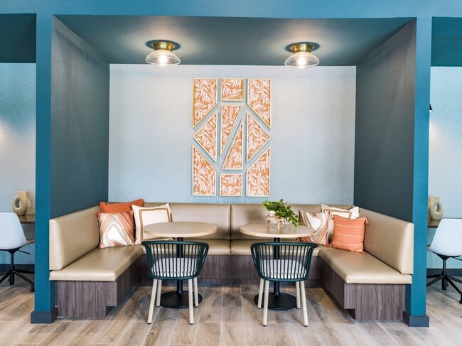 Boost your productivity at Modera Georgetown's coworking space, where innovation meets comfort. With access to private conference rooms, elevate your work game in style. - Modera Georgetown