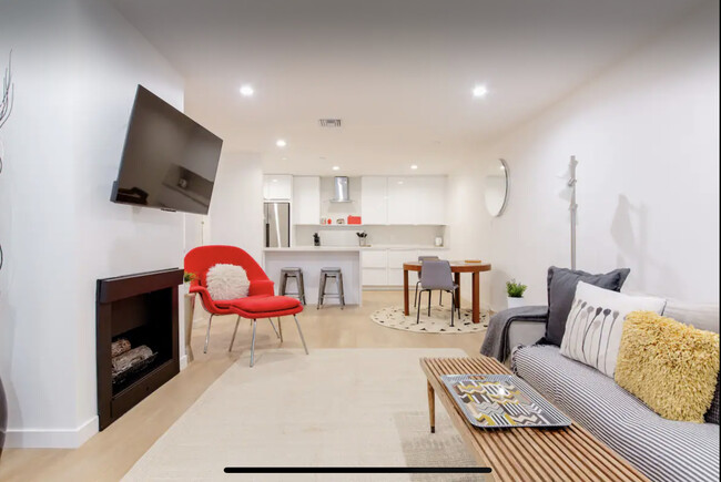 Living room facing kitchen - 8535 Knoll N W Dr