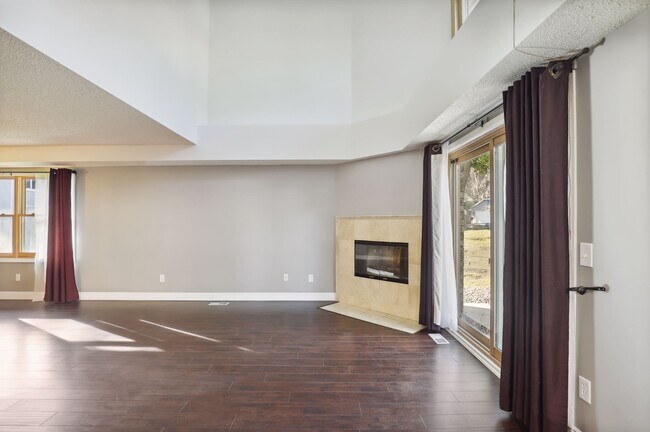 Woodburning fireplace and vaulted living room celings - 18717 Clear View Ct
