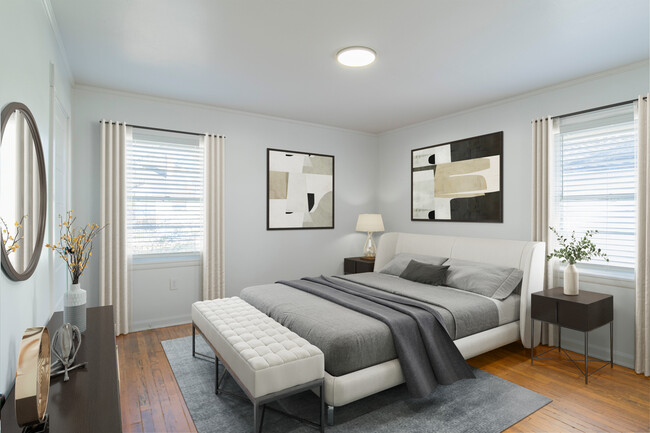 Generous Bedrooms featuring original hardwood flooring. - Ann Street Lofts