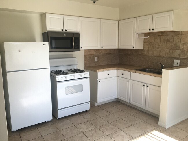 Kitchen with sunlight entering - 7629 Normal Ave