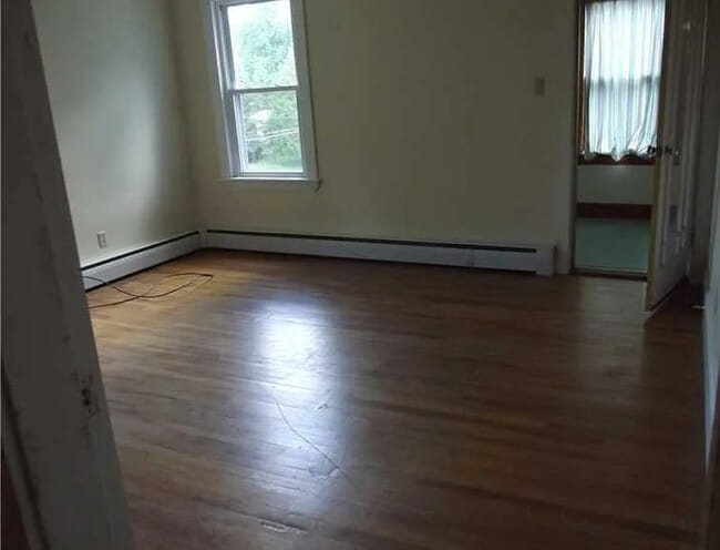 Living room sunroom to the right front of building - 6 Hallowell St