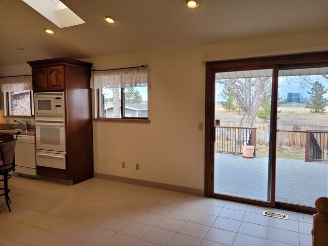 Kitchen nook overlooking upper back deck - 9637 W Ohio Ave