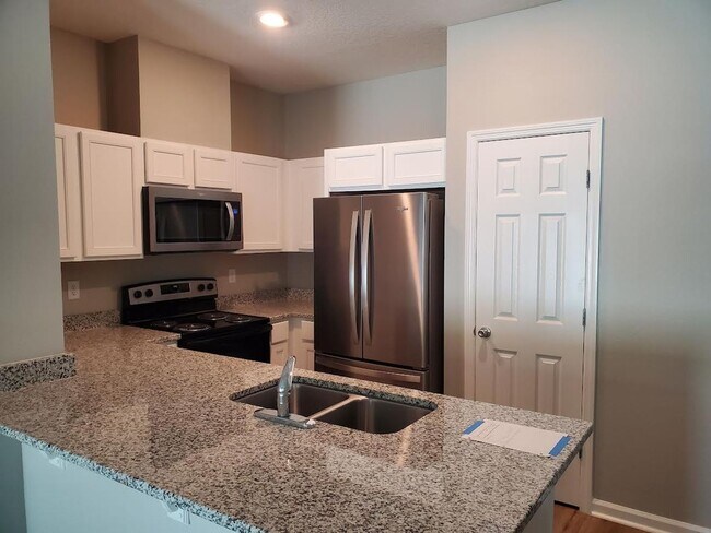 Building Photo - BRAND NEW 3/2.5 Town Home in Greenland Pla...
