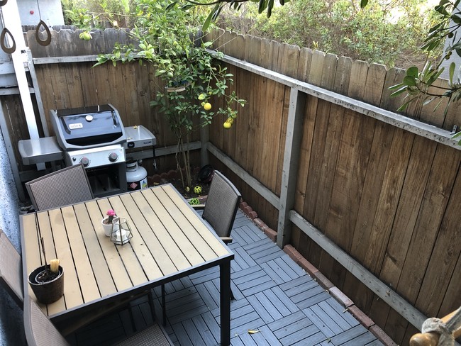 Back patio with updated flooring - 1809 Armour Ln