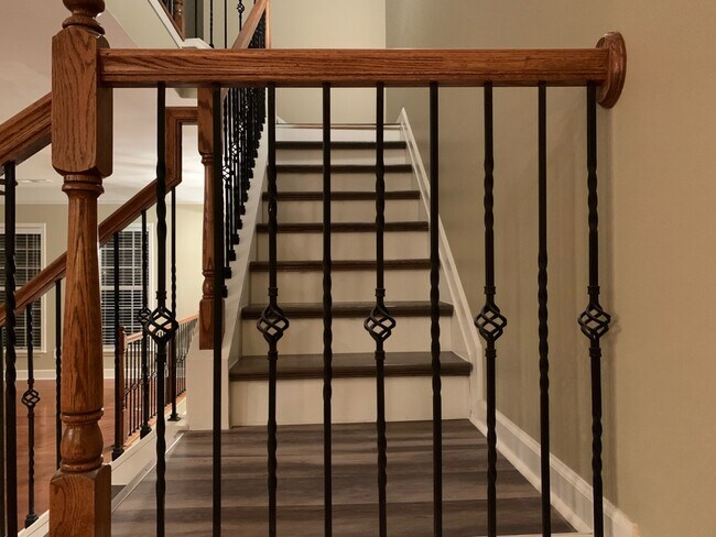 Stairs leading to the second floor. - 2289 Limehurst Dr