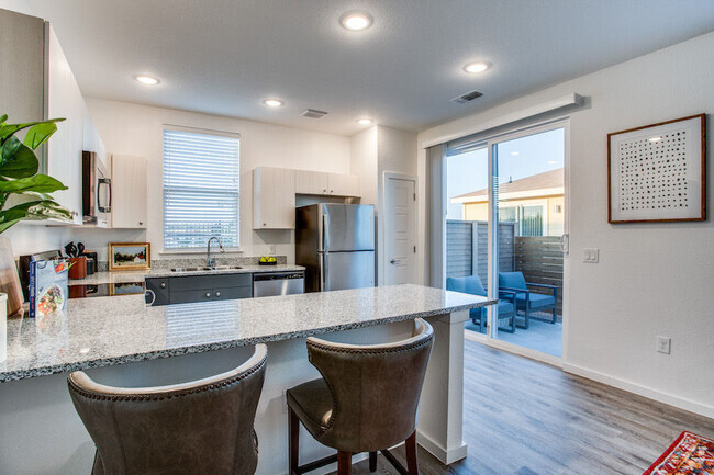 Kitchen with Sliding Door to Private Yard - Estates at Plum Creek