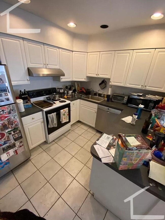 Photo - Parking Included, Central Heat/AC, In Unit Washer and Dryer, Deck, Backyard, Eat-in Kitchen Townhome