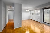 Located at 39 Brookwell Dr in Toronto's northwest end, this two-storey, 2-bedroom, 1-bathroom unit offers a practical and well-organized layout spread across two floors. The main level houses the kitchen and primary living areas, while the upper level accommodates the bedrooms and bathroom. Throughout the unit, warm parquet flooring adds a classic character to the space.

The kitchen is efficiently laid out with white cabinetry featuring gold-toned hardware, dark laminate countertops, a coil-element electric range, and an under-mount sink. A large window above the counter fills the kitchen with natural light and offers a pleasant view of the surrounding greenery.

Both bedrooms are bright and well-proportioned, each featuring wide windows that bring in natural light and views of the neighbourhood's tree-lined surroundings. The primary bedroom is generously sized and includes a sliding-door closet for storage. The second bedroom also features a sliding closet. Baseboard heaters are present throughout, ensuring consistent warmth. The bathroom is clean and straightforward, featuring a full tiled tub-shower surround with chrome fixtures. Two hallways provide smooth circulation between levels and rooms, with a dedicated closet rounding out the unit's storage options.