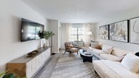 Located at 1400 Village Blvd in West Palm Beach, FL, this one-bedroom, one-bathroom residence offers a well-designed layout that maximizes comfort and functionality. The open-concept living and dining area is bright and welcoming, featuring wood-look flooring, neutral tones, and large windows dressed with sheer curtains that invite abundant natural light. The space flows seamlessly, making it ideal for both relaxing and entertaining.

The galley-style kitchen is thoughtfully appointed with rich wood cabinetry, granite countertops, a double-basin sink, and black appliances including a refrigerator, range, and built-in microwave. Ample counter and storage space make it both practical and visually appealing.

The bedroom offers a comfortable retreat with plush carpeting, a ceiling fan, natural light from a window with blinds, and generous closet storage. The room comfortably accommodates a full furniture arrangement.

The bathroom features warm wood vanity cabinetry, granite countertops, a large mirror, and a tiled shower-tub combination, conveying a clean and polished aesthetic.

A private balcony extends the living space outdoors, offering a spot to enjoy the Florida climate. Throughout the residence, the neutral palette, consistent finishes, and thoughtful layout create a cohesive and inviting ambiance.