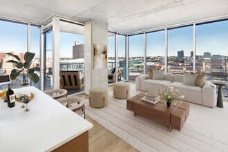 The living room of the 2B B1 - East Balcony floor plan at One Light Luxury Apartments - One Light Luxury Apartments