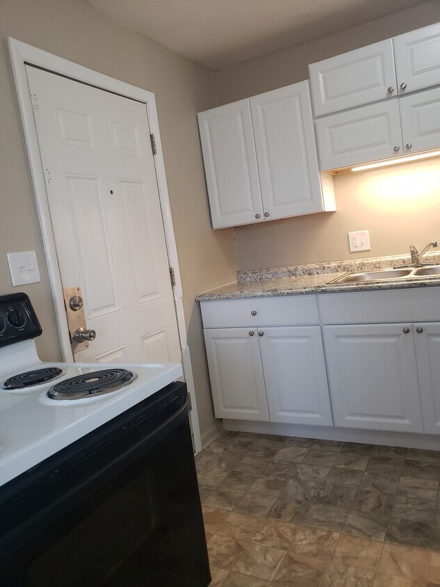 Kitchen with back door to the left - 2322 Ontario St.