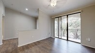 This contemporary 650 square foot apartment in Cedar Park, Texas, offers a perfect blend of comfort and style. The one-bedroom unit features an open-concept layout that maximizes space efficiency. The kitchen is a standout, boasting stainless steel appliances, sleek cabinetry with a built-in wine rack, and elegant marble-like countertops. The living area seamlessly connects to a private balcony through sliding glass doors, providing natural light and views of the surrounding greenery. The spacious bedroom, measuring 180 square feet, includes plush carpeting and ample closet space. The bathroom is modern and well-appointed with a large vanity and tiled shower/tub combination. Throughout the apartment, you'll find a cohesive design with neutral tones, crown molding, and durable wood-look flooring in the main living areas. With its thoughtful layout and updated features, this apartment offers a turnkey living solution in a desirable location.