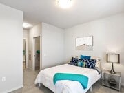 Bedroom with white bed and blue accents