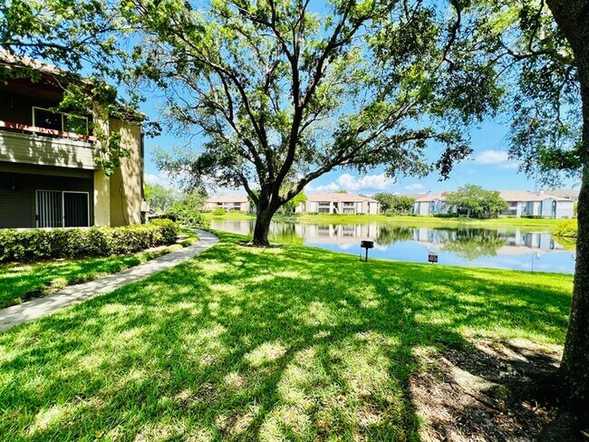 Building Photo - ? Charming 1/1 Condo in Resort-Style Community with Pool & Gym