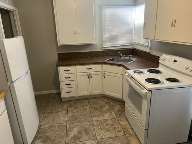 Building Photo - Updated home with 2 car carport and washer/dryer