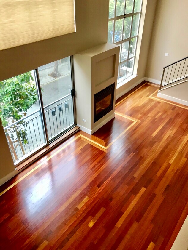 Your living room has rich Brazilian cherry floors and lots of natural light - 1095 Natoma St